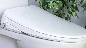 Fluid toilet with washlet seat, c/w electrical outlet behind toilet - (1) in ensuite, (1) in main bathroom, (1) in 2nd ensuite, & (1) in powder room